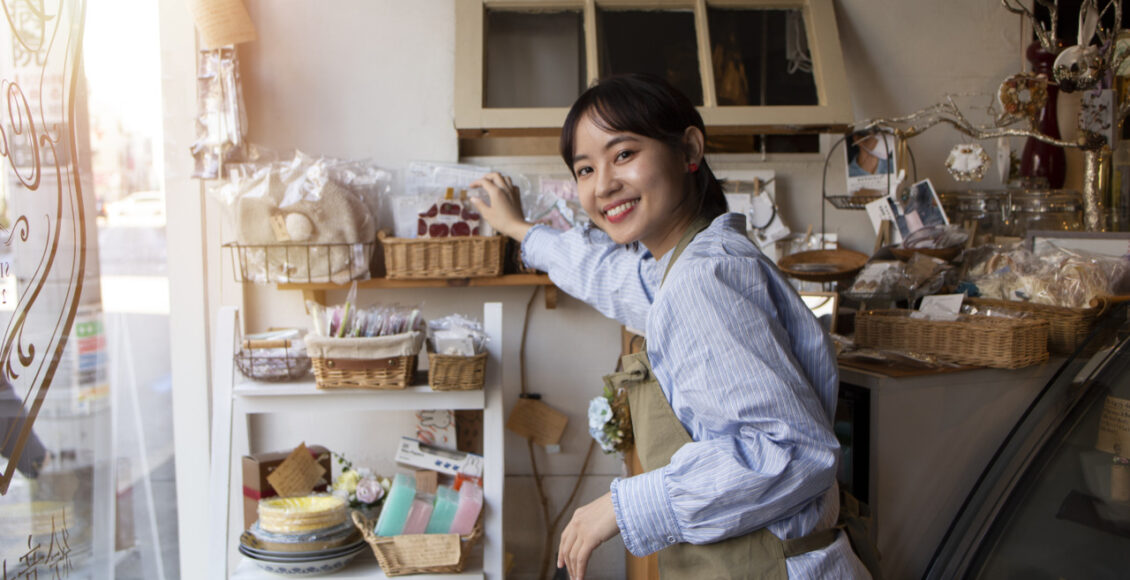 Young Woman Arranging Her Cake Shop