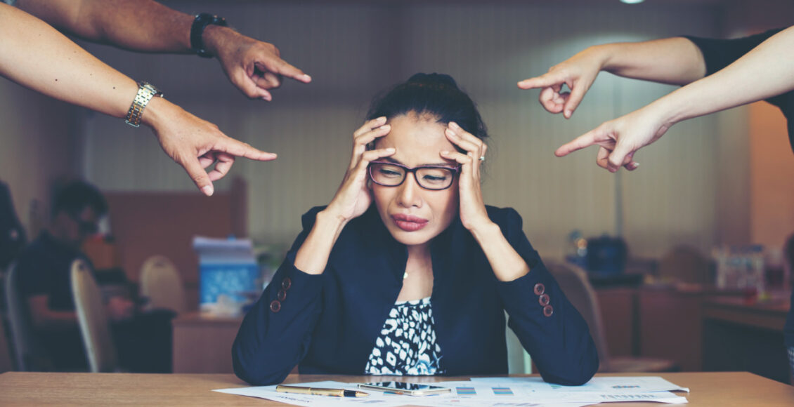 Frustrated Business Woman Sitting At The Table In Office.