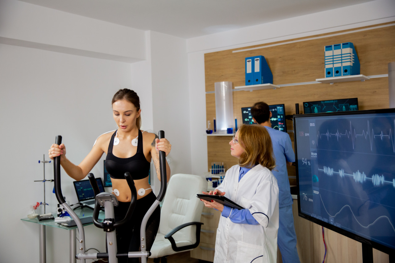 Female Athlete Doing Physical Effort On The Stepper And The Doctor Follows Her