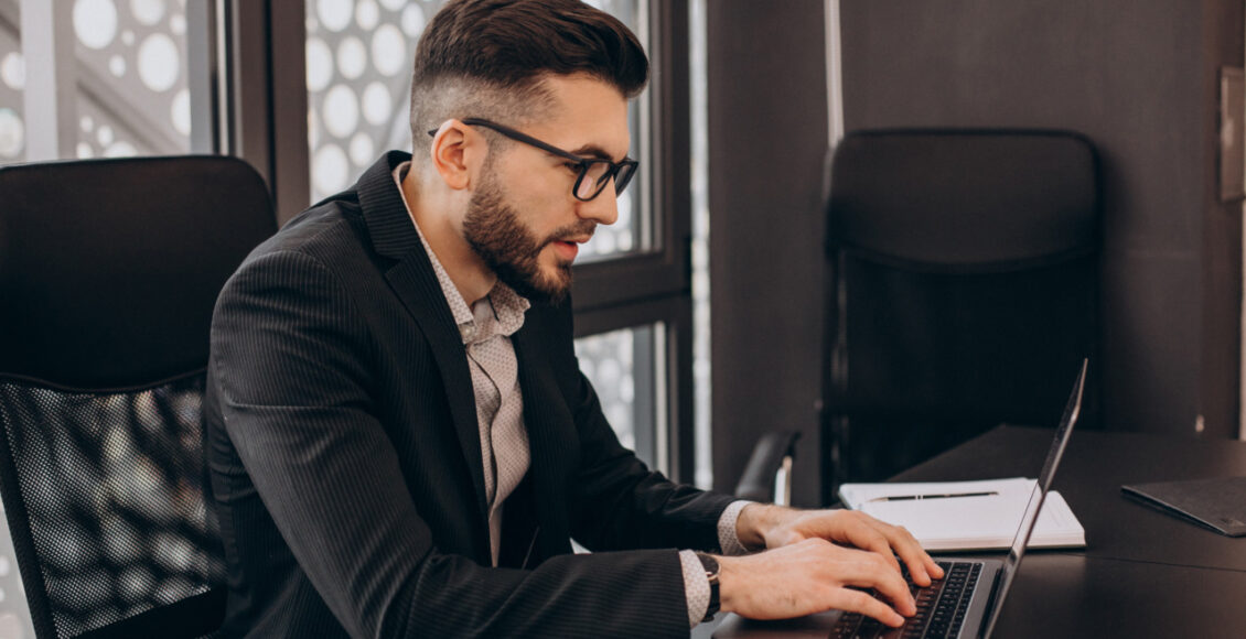 Handsome Business Man Working On Computer