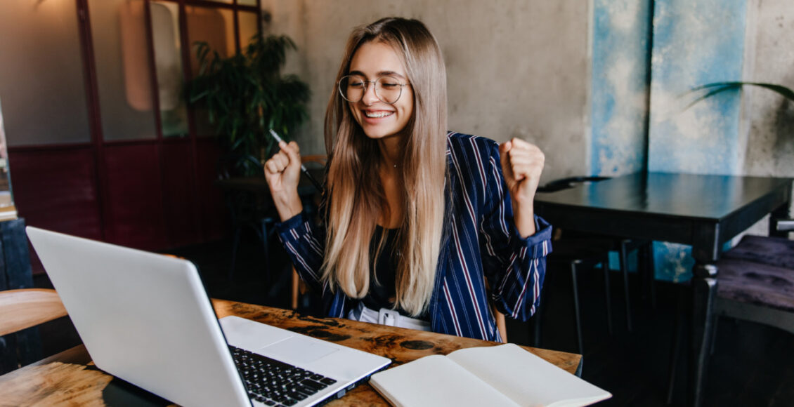 Excited Long Haired Girl Having Fun During Work With Computer. I