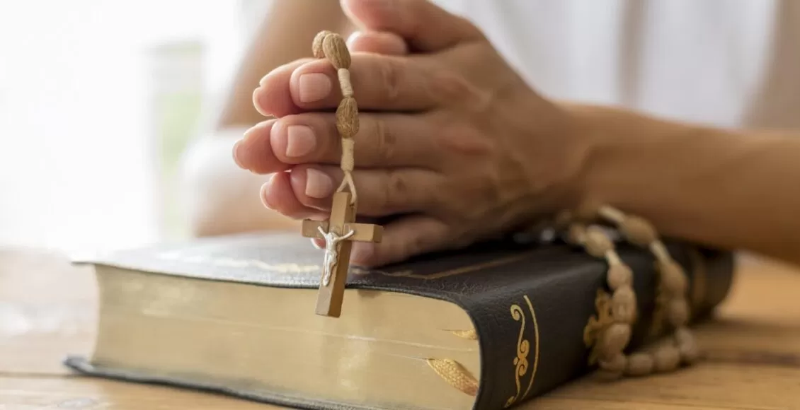 Person Praying With Rosary Holy Book