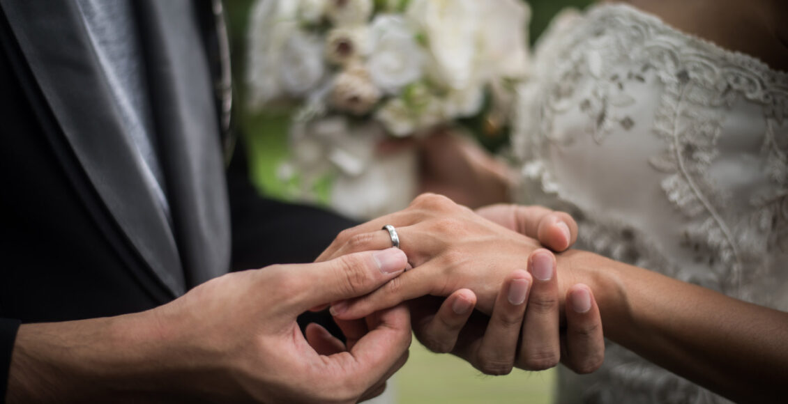 Close Up Of Groom Wears The Ring Bride In Wedding Day. Love, Hap