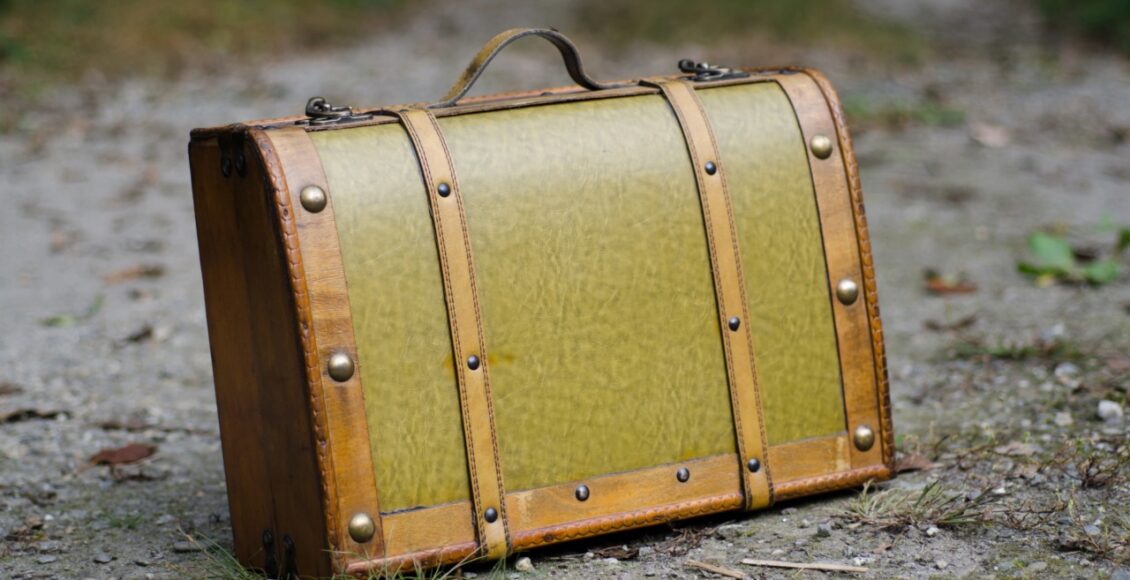 Selective Focus Shot Of An Old Green Suitcase With Retro Elements