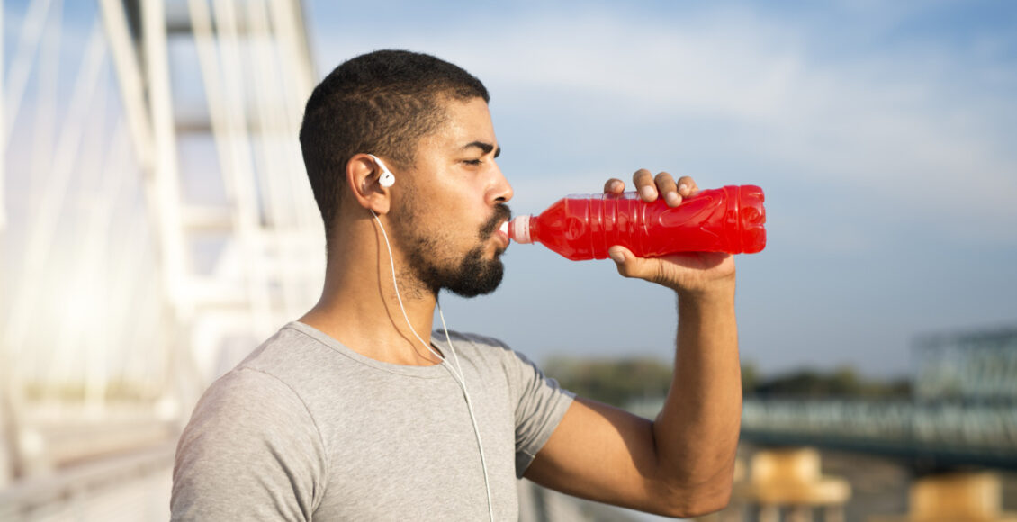 Athlete Drinking Sports Drink To Get More Energy For Training.