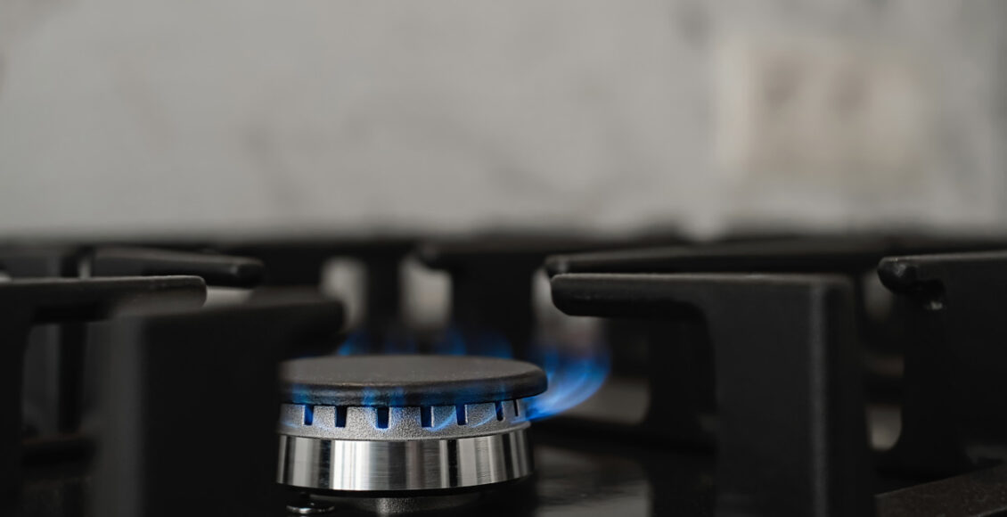Modern Kitchen Stove, Natural Gas Burns With A Blue Flame. Household Gas Consumption. Close Up, Selective Focus